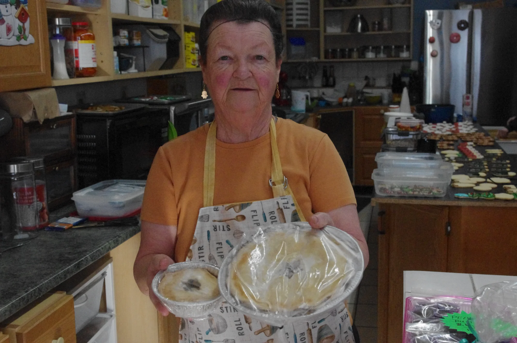 Kathy holding her homemade pies